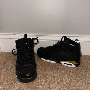 boys high top black and gold jordan's.
